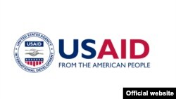 Эмблема Агентства США по международному развитию (USAID).