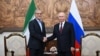 Russia's President Vladimir Putin (right) and Iran's President Masud Pezeshkian shake hands during a meeting on the sidelines of the Shanghai Cooperation Organization (SCO) summit in Bishkek.