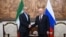 Russia's President Vladimir Putin (right) and Iran's President Masud Pezeshkian shake hands during a meeting on the sidelines of the Shanghai Cooperation Organization (SCO) summit in Bishkek.