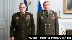  U.S. Chairman of the Joint Chiefs of Staff General Mark Milley (left) poses with his Russian counterpart, Valery Gerasimov, during their meeting in Helsinki on September 22.