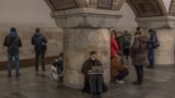 People take shelter in a subway station during an air-raid alert in Kyiv on November 20.