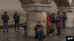 People take shelter in a subway station during an air-raid alert in Kyiv on November 20.