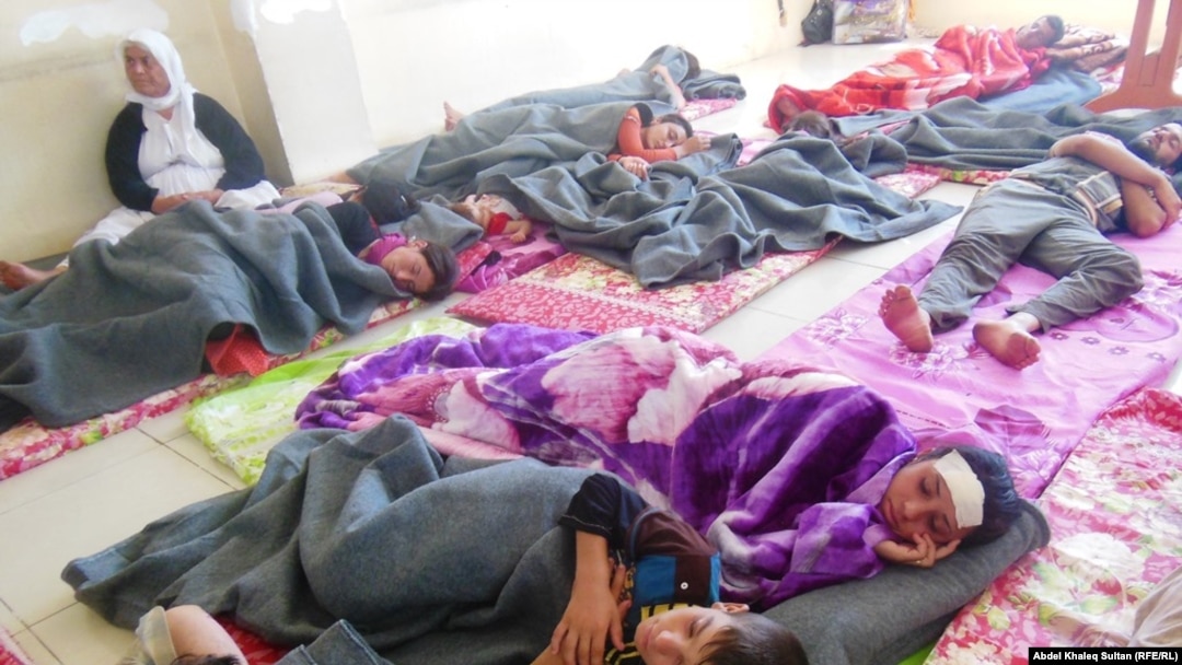 Displaced Yazidis in the Duhok province on August 8 after returning from the Sinjar Mountains.