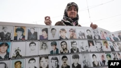 A member of the "Mothers of Srebrenica" demonstrates in front of the European Court of Human Rights (CEDH) in Strasbourg on October 11. 