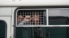 Крымчане, задержанные у здания Верховного суда России за акцию поддержки крымских татар, осужденных по первому бахчисарайскому «делу Хизб ут-Тахрир». Москва, 11 июля 2019 года