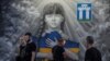 People pass by a patriotic mural in central Rivne, Ukraine, on May 31.