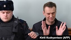 Kremlin critic Aleksei Navalny, who was arrested at a March 26 anticorruption rally, appears at an appeal hearing at a court in Moscow on March 30.