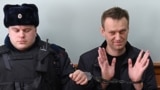 RUSSIA -- Kremlin critic Aleksei Navalny, who was arrested during March 26 anti-corruption rally,gestures during an appeal hearing at a court in Moscow, March 30, 2017