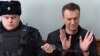 Kremlin critic Aleksei Navalny, who was arrested during March 26 anti-corruption rally,gestures during an appeal hearing at a court in Moscow, March 30, 2017