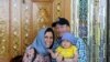 IRAN -- British-Iranian woman Nazanin Zaghari-Ratcliffe (L) with her husband Richard Ratcliffe and daughter Gabriella, undated