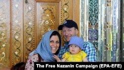 IRAN -- British-Iranian woman Nazanin Zaghari-Ratcliffe (L) with her husband Richard Ratcliffe and daughter Gabriella, undated