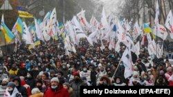 People working in the small business sector march during a rally demanding support for individual entrepreneurs in Kyiv on December 4.