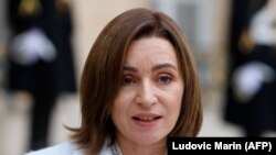 FRANCE -- Moldovan President Maia Sandu speaks during a joint statement with French President before a meeting at the Elysee Presidential Palace in Paris, February 4, 2021