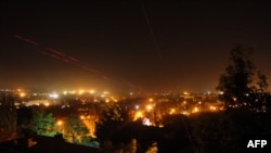 Tracer bullets can be seen being fired by pro-Russian militants at the National Guard base in Luhansk overnight on June 3-4.