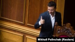 Ukrainian President Volodymyr Zelenskiy gives a thumbs up during a parliamentary session in Kyiv on September 3.