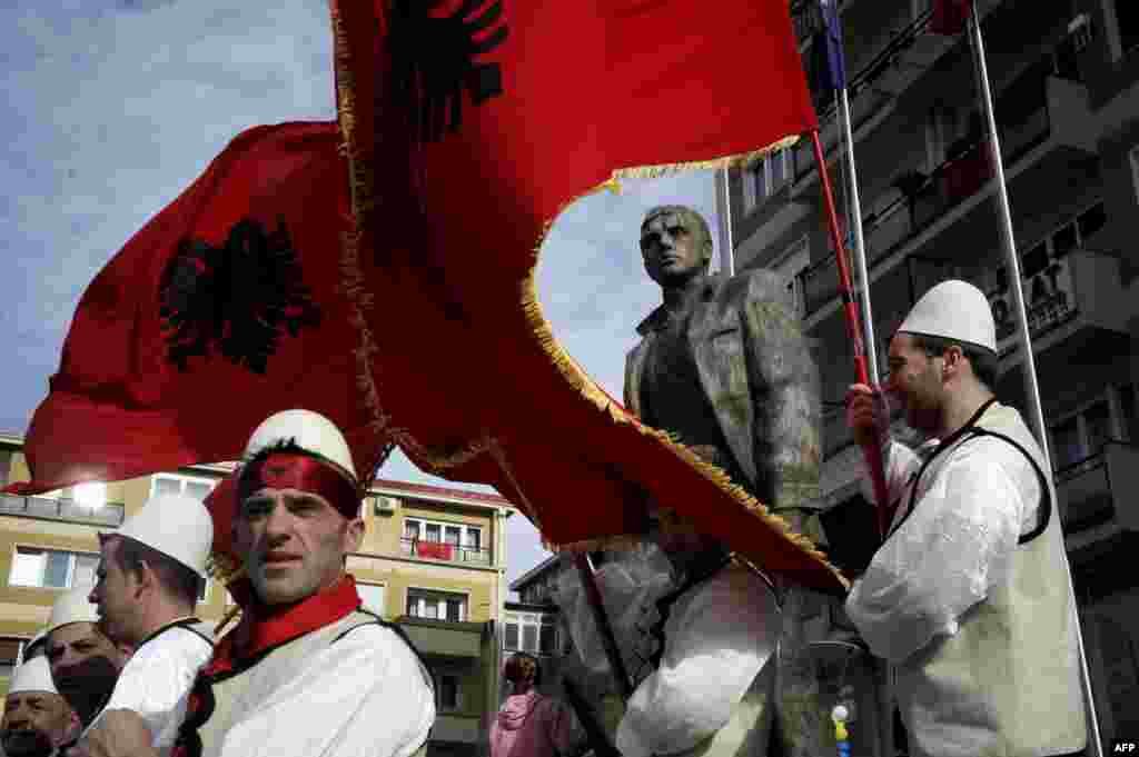Kosovars wave Albanian flags as they take part in celebrations marking the sixth anniversary of Kosovo's declaration of independence from Serbia in Pristina on February 17. (AFP/Armend Nimani)