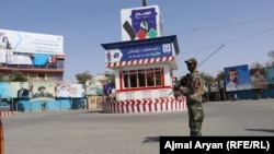 Afghan security forces stand guard in Kunduz city on August 31.