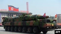 North Korea -- A military vehicle carries what is believed to be a Taepodong-class missile Intermediary Range Ballistic Missile, about 20 meters long, during a military parade to mark the 100 birth of Kim Il-Sung in Pyongyang, 15Apr2012