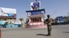 Afghan security forces stand guard in Kunduz city on August 31.