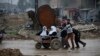 Civilians flee the city of Mosul on March 23 as Iraqi forces advance in their massive operation to retake Iraq's second city from Islamic State militants.