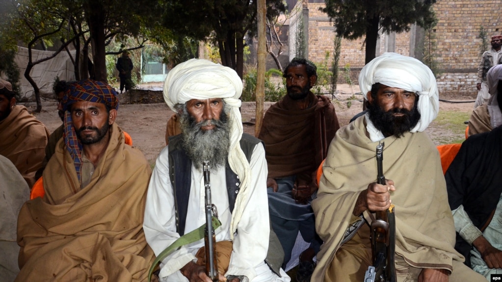 FILE: Purported members of the banned Baloch Liberation Army organization wait to hand over their weapons during a surrender ceremony in Quetta, capital of Balochistan Province in November 2015.