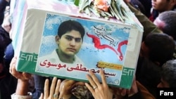 A member of the Islamic Revolutionary Guards Corps, who was killed in Syria, is mourned in Iran. 