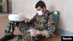 An Islamic cleric in the Iranian city of Isfahan rests while while fighting the coronavirus. 