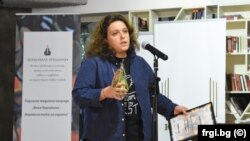 RFE/RL's Polina Paunova receiving the Valya Krushkina Grand Prix journalist award.