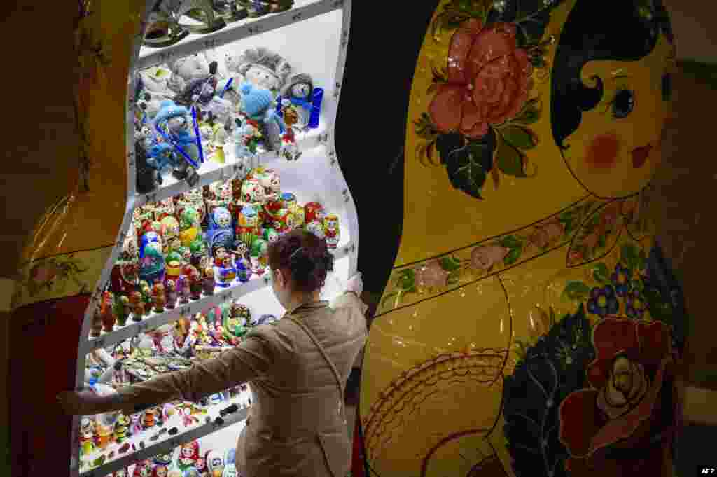 A giant Matryoshka doll is used to display Matryoshka dolls at a shop at a stall in a newly opened shopping mall in the Olympic Village of Rosa Khutor during the Sochi Winter Olympic Games. (AFP/Odd Andersen)