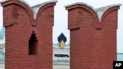 The headquarters of Russia's state-owned oil giant Rosneft is seen through the walls of the Kremlin. (file photo)