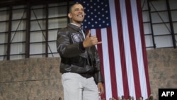 Afghanistan -- US President Barack Obama does a Hawaiian "shaka" as he greets US troops during a surprise visit to Bagram Air Field, north of Kabul, May 25, 2014