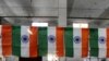 India -- A worker folds an Indian National Flag at Roopalee Textiles in Ahmedabad, 19Jan2010