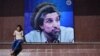 An Afghan boy sits next to poster bearing the image of the late resistance leader Ahmad Shah Masud in Kabul. (file photo)