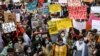 Human right activists protest in Lahore on September 12 against the alleged gang rape of a woman in front of her children.