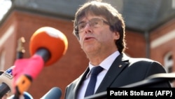 Carles Puigdemont speaks to the press in Neumuenster in April 2018.