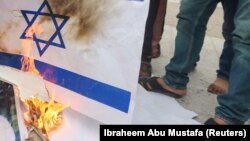 İsrail bayrağının yandırılması. Foto arxiv