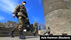 Azerbaijani servicemen patrol the streets of Baku amid a coronavirus lockdown.