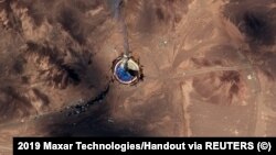 A satellite shows what is described as a burning launch pad in Iran on August 29.