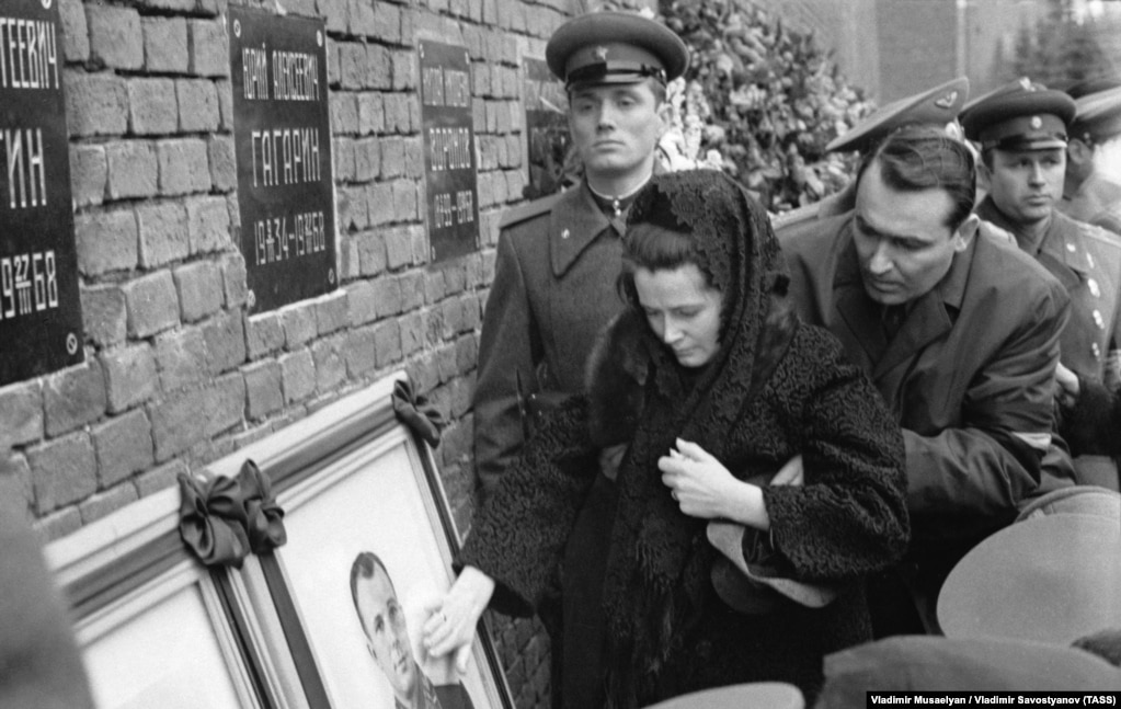 Gagarin's widow, Valentina, touches his portrait during his funeral at the Kremlin on March 30, 1968. Gagarin and a co-pilot died in a crash during a training flight, the cause of which remains unclear.&nbsp;