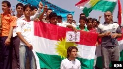 Iraqi Kurdish demonstrators in Irbil protest the passage of a bill delaying the census in the disputed region of Kirkuk.