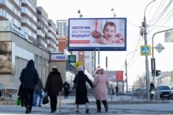 A billboard promoting the nationwide vote on amendments to the constitution is seen in Novosibirsk on March 24. Postponing the vote on April 22 due to the pandemic would be a headache for Putin’s government.