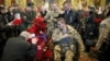 Ukrainian servicemen stand near a coffin containing the body of Ihor Branovytskiy during a funeral service in Kyiv on April 3.