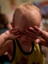 Ukraine -- A child is crying in the bomb shelter in Petrovskiy district of Donetsk 6/8/15