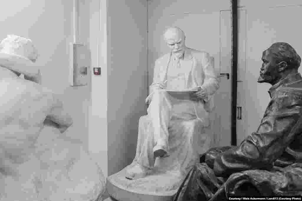 Two Lenin statues sit in storage at the National Art Museum in Kyiv.&nbsp;