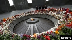 People mourn at the Tsitsernakaberd Armenian Genocide Memorial Museum in Yerevan on April 21.