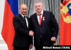 Russian President Vladimir Putin (left) bestows an award on Vladimir Zhirinovsky in May 2015.
