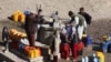 Afghanistan - Afghan's fill cans with drinking water from a community tap in Kabul on January 17, 2011