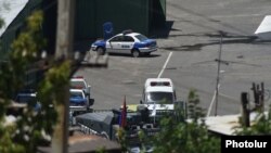 Armenia - Vehicles parked inside a police compound in Yerevan seized by anti-government gunmen, 22Jul2016.