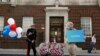 A look-alike of Britain&#39;s Prince Harry takes part in a publicity stunt in front of the Lindo Wing of St. Mary&#39;s Hospital, where Kate, officially known as the Duchess of Cambridge, is in labor. 