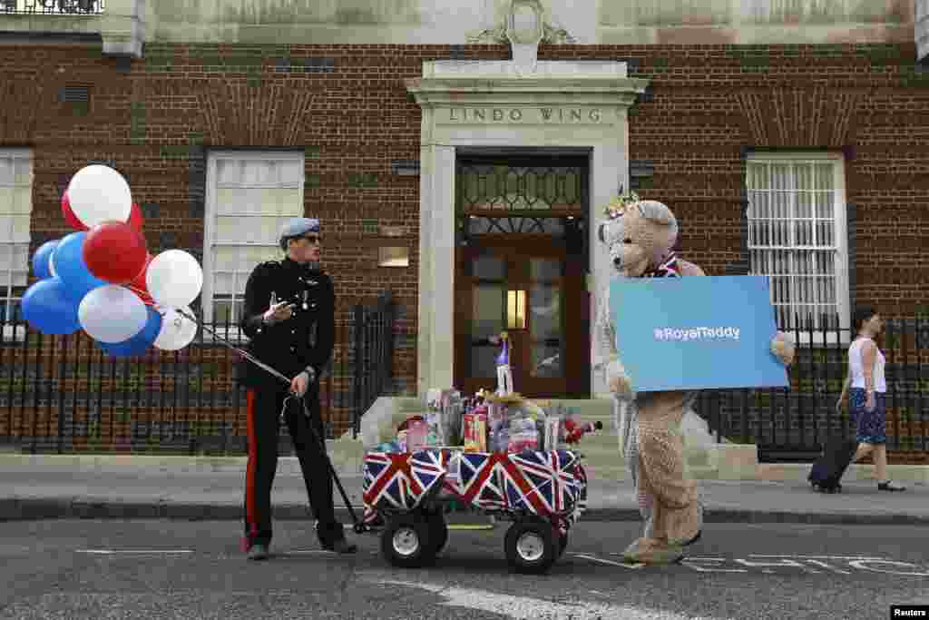 A look-alike of Britain's Prince Harry takes part in a publicity stunt in front of the Lindo Wing of St. Mary's Hospital, where Kate, officially known as the Duchess of Cambridge, is in labor.
